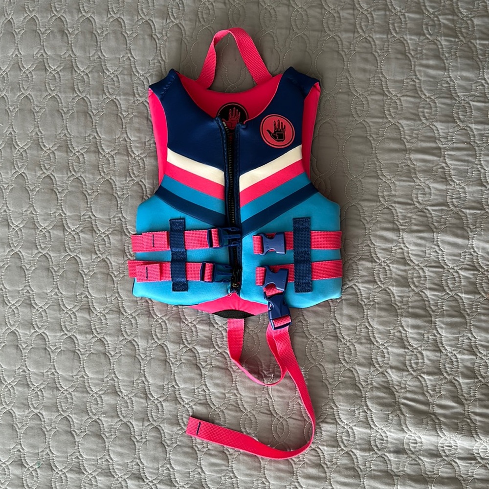 Kids life-jacket. Multi-color. For 33-55 lbs. Worn once.
